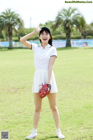 A woman in a white skirt holding a baseball bat.