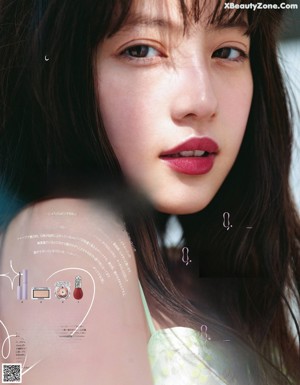 A magazine cover with a young woman in a pink dress.