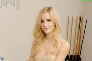 A woman in a black top and white panties posing for a picture.