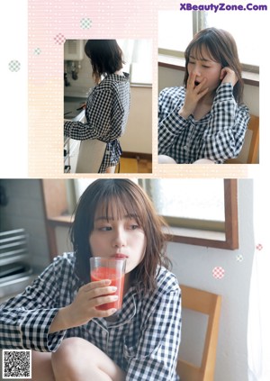 A woman in a black and white checkered shirt leaning against a window.