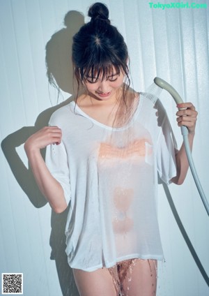 A woman in a blue dress posing for a picture.